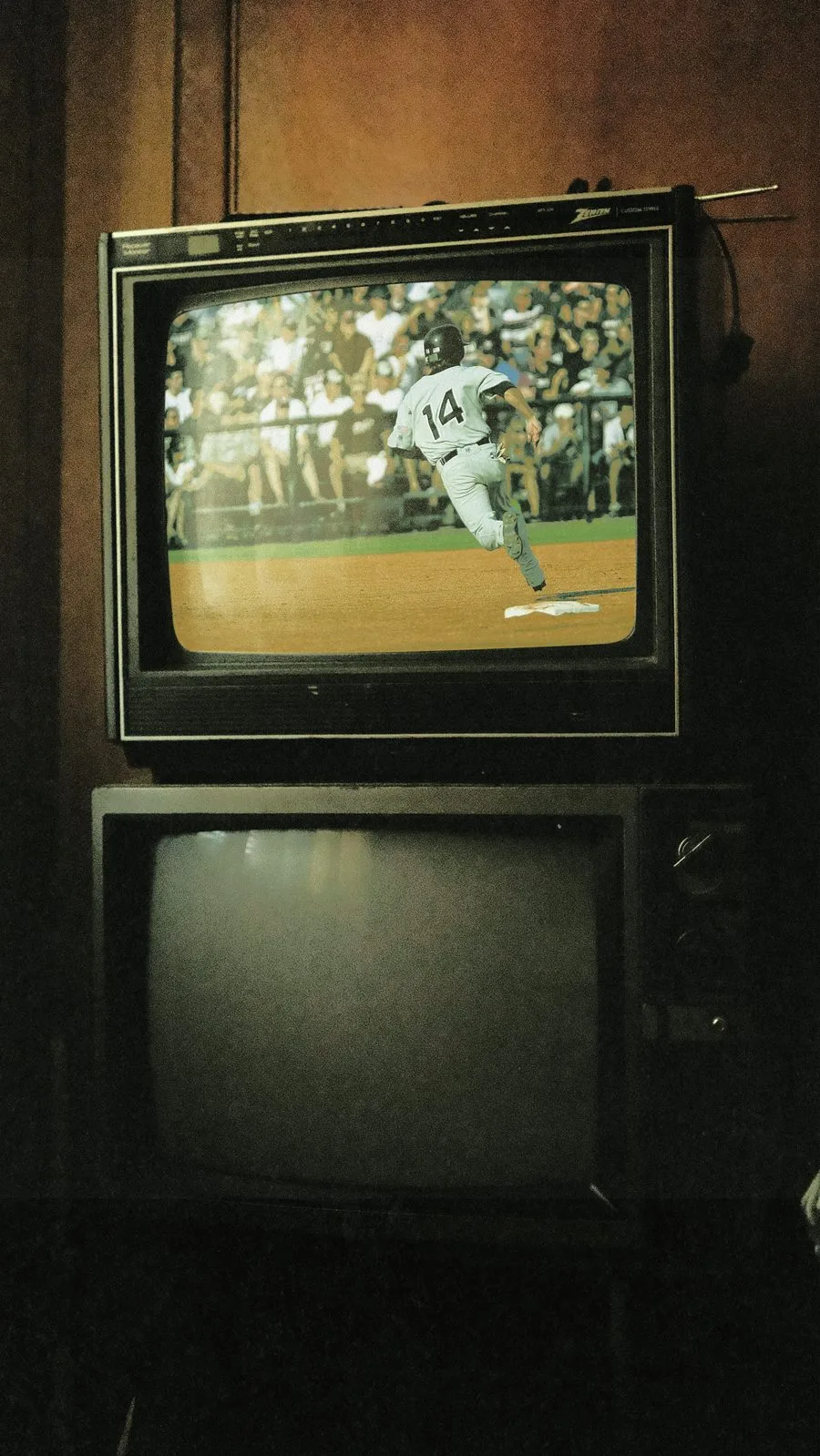 An old television playing a baseball game, in the same grainy, faded treatment